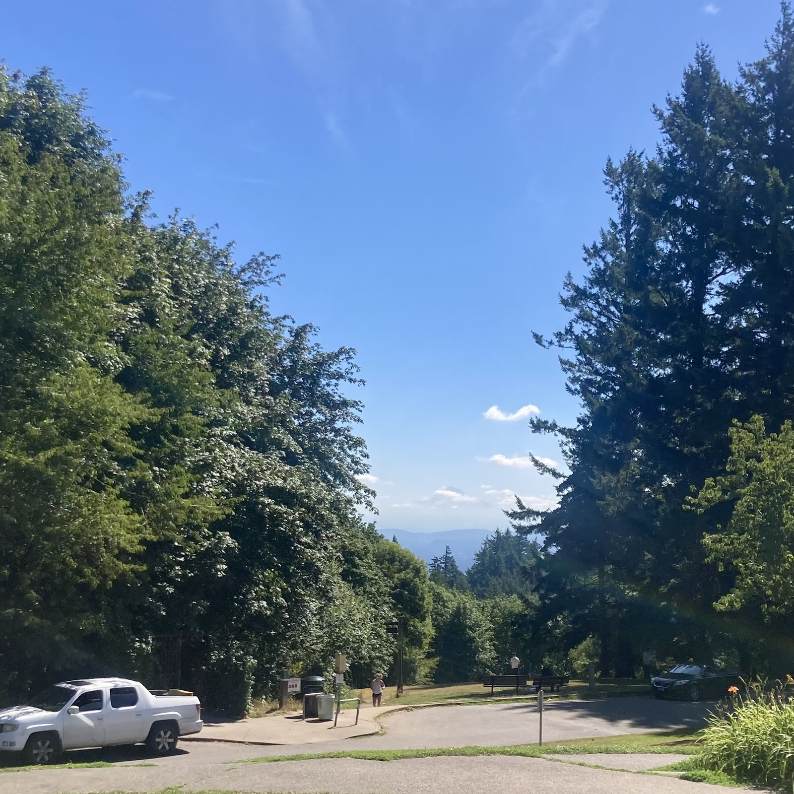 A few small low clouds (from the “marine layer”) cling to the foot of Mt. Hood on an otherwise clear summer morning
