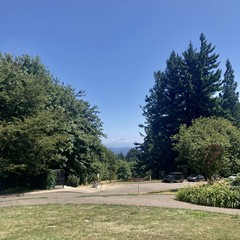 Mt. Hood, photographed from Council Crest Park in early afternoon. A little snow on the peak and one tiny cloud just behind the mountain. Deep clear sky overhead